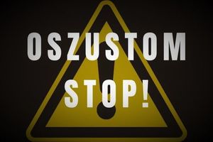 znak drogowy z napisem OSZUSTOM STOP!
