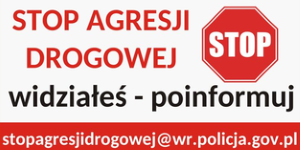 Na zdjęciu napisane jest Stop agresji drogowej widziałeś poinformuj. Widnieje również znak drogowy pionowy STOP, a na dole wskazany jest adres e-mali